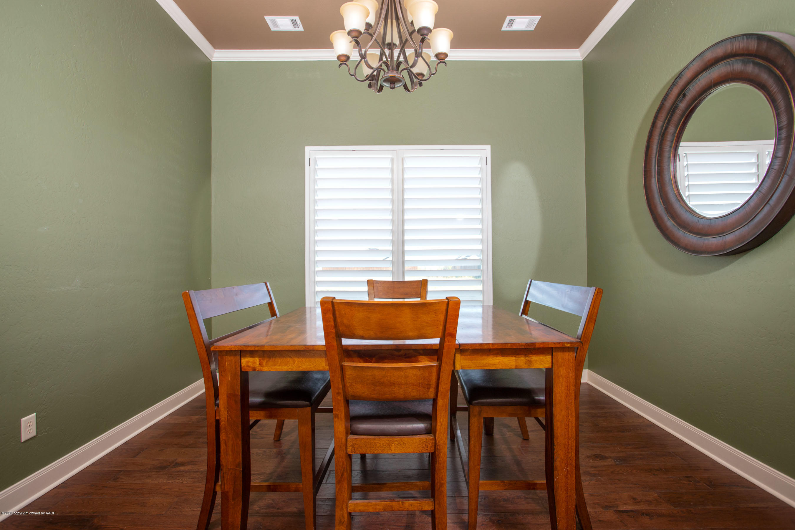 3917 Arden Road Amarillo, TX 79118 - Photo 6 of 17 a view of a dining room with furniture and chandelier