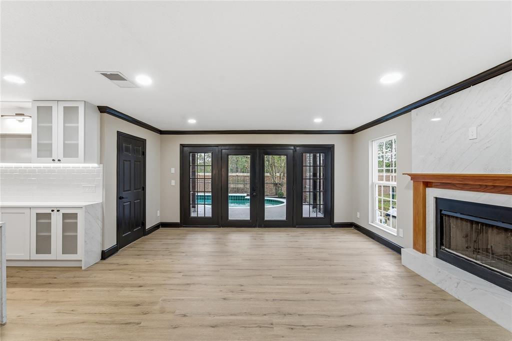 14728 Henson Road Orlando, FL 32832 - Photo 63 of 79 a view of an empty room with a fireplace and a window