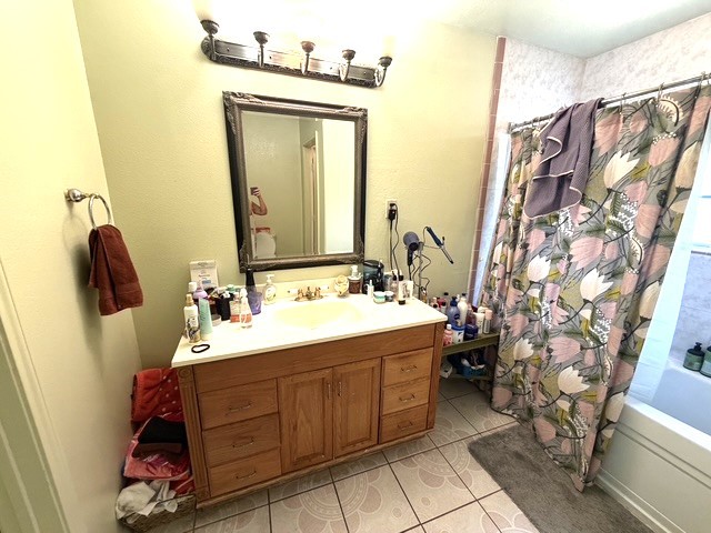 3080 Lee Turner Road Cleveland, TX 77328 - Photo 7 of 48 The primary bathroom offers a spacious vanity with abundant cabinet and drawer storage, generous counter space, and a tub/shower combination for everyday convenience.