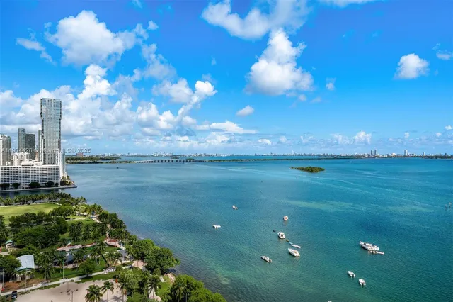 a view of a swimming pool with outdoor seating
