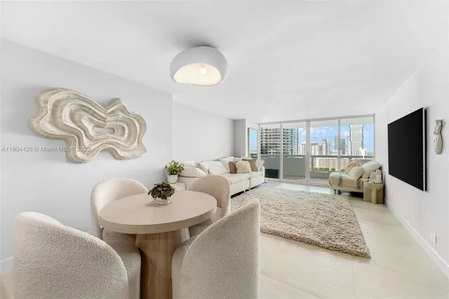 a kitchen with a table and chairs in it