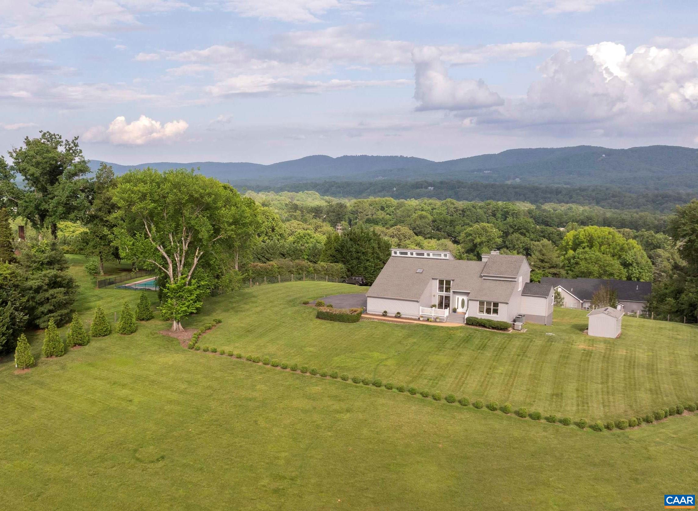 2413 Wakefield Road Charlottesville, VA 22901 - Photo 1 of 61 a view of a lake with a mountain in the background