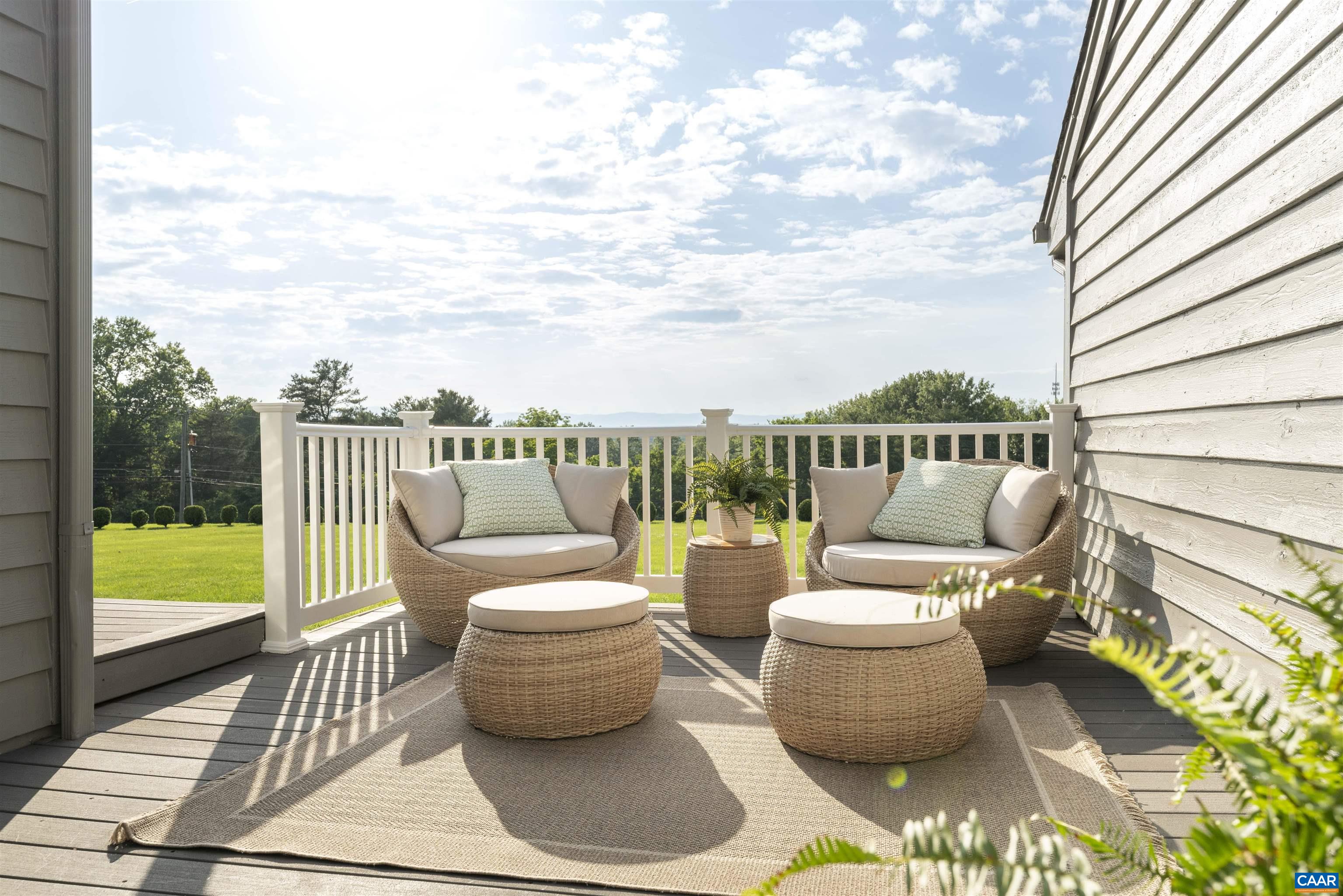 2413 Wakefield Road Charlottesville, VA 22901 - Photo 8 of 61 a view of a patio with couches chairs and wooden floor