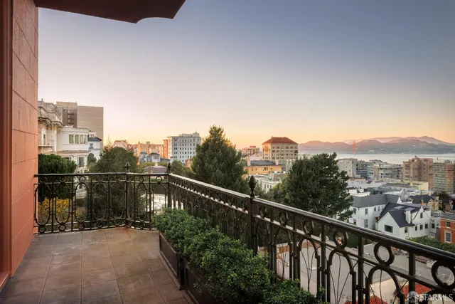 a dining room with furniture a chandelier and window