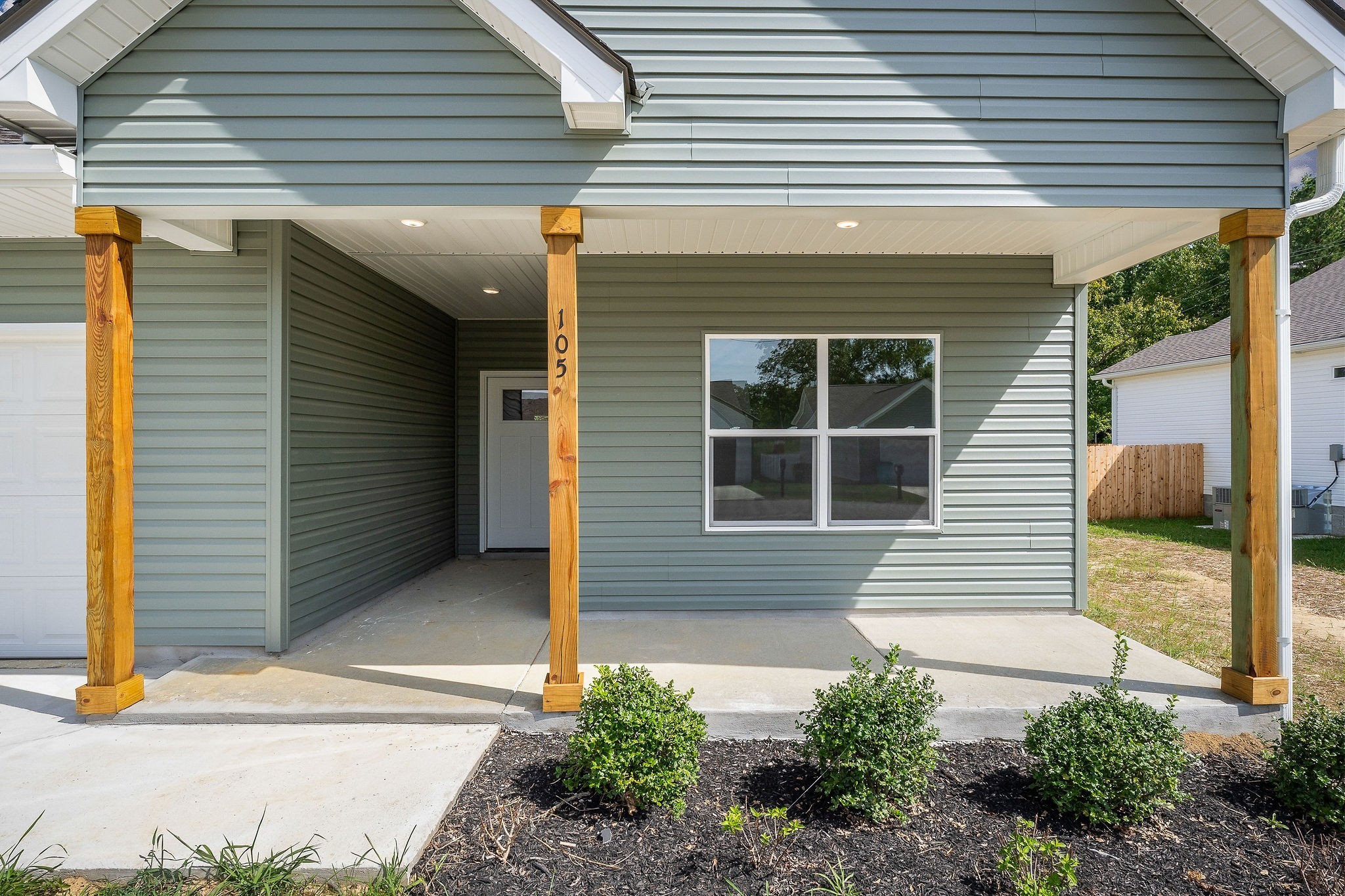 105 Reece Road Baxter, TN 38544 - Photo 29 of 33 a front view of a house with a yard and garage