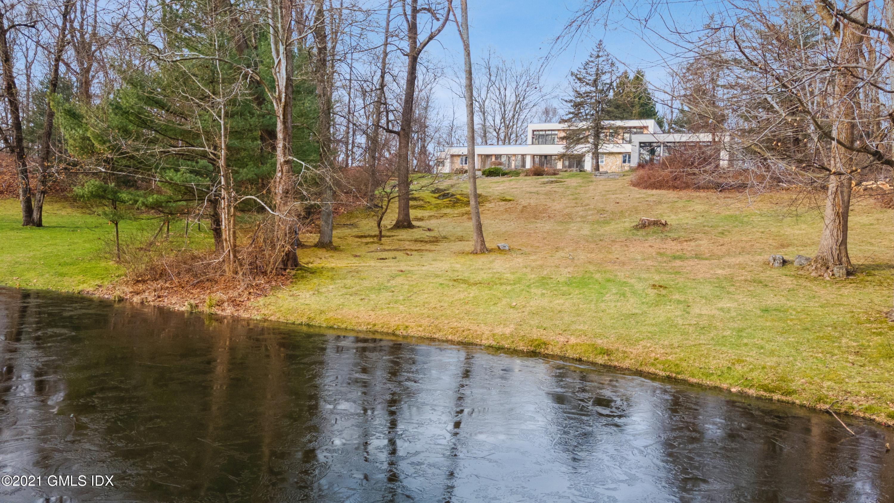 a view of a yard with swimming pool