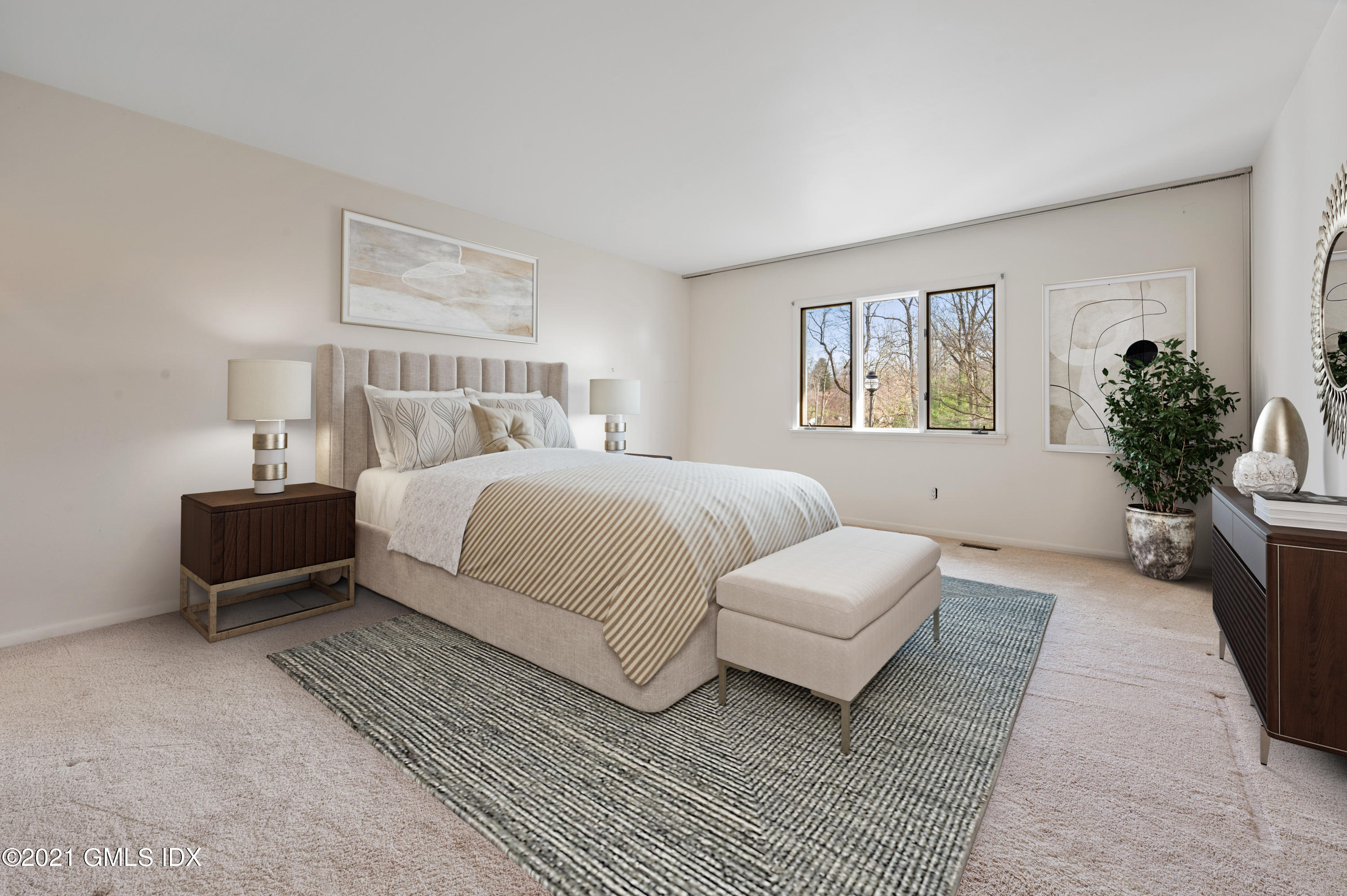 39 Cliffdale Road Greenwich, CT 06831 - Photo 13 of 25 a bedroom with a bed a couch and potted plant