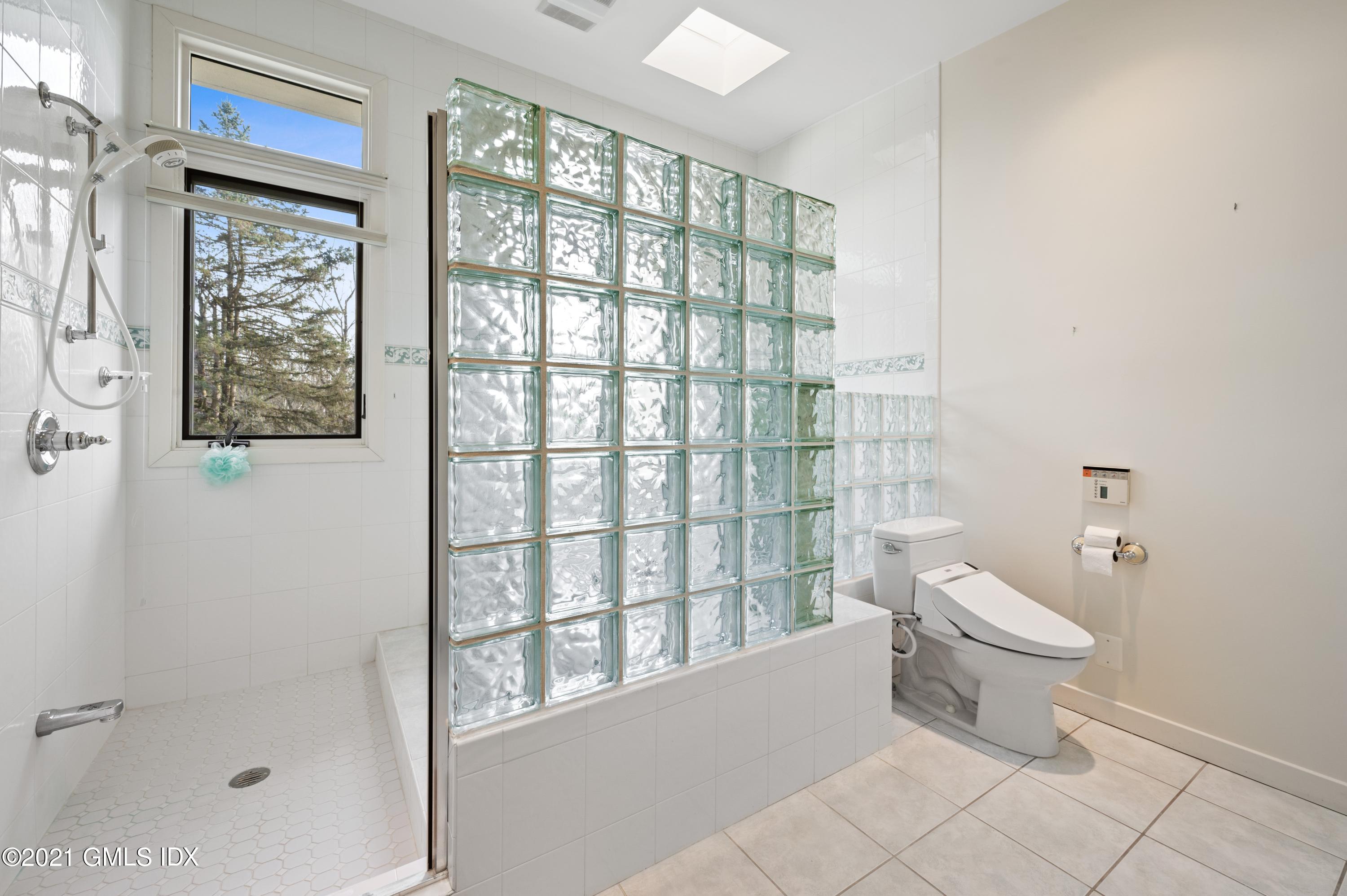 39 Cliffdale Road Greenwich, CT 06831 - Photo 16 of 25 a bathroom with a toilet sink and shower