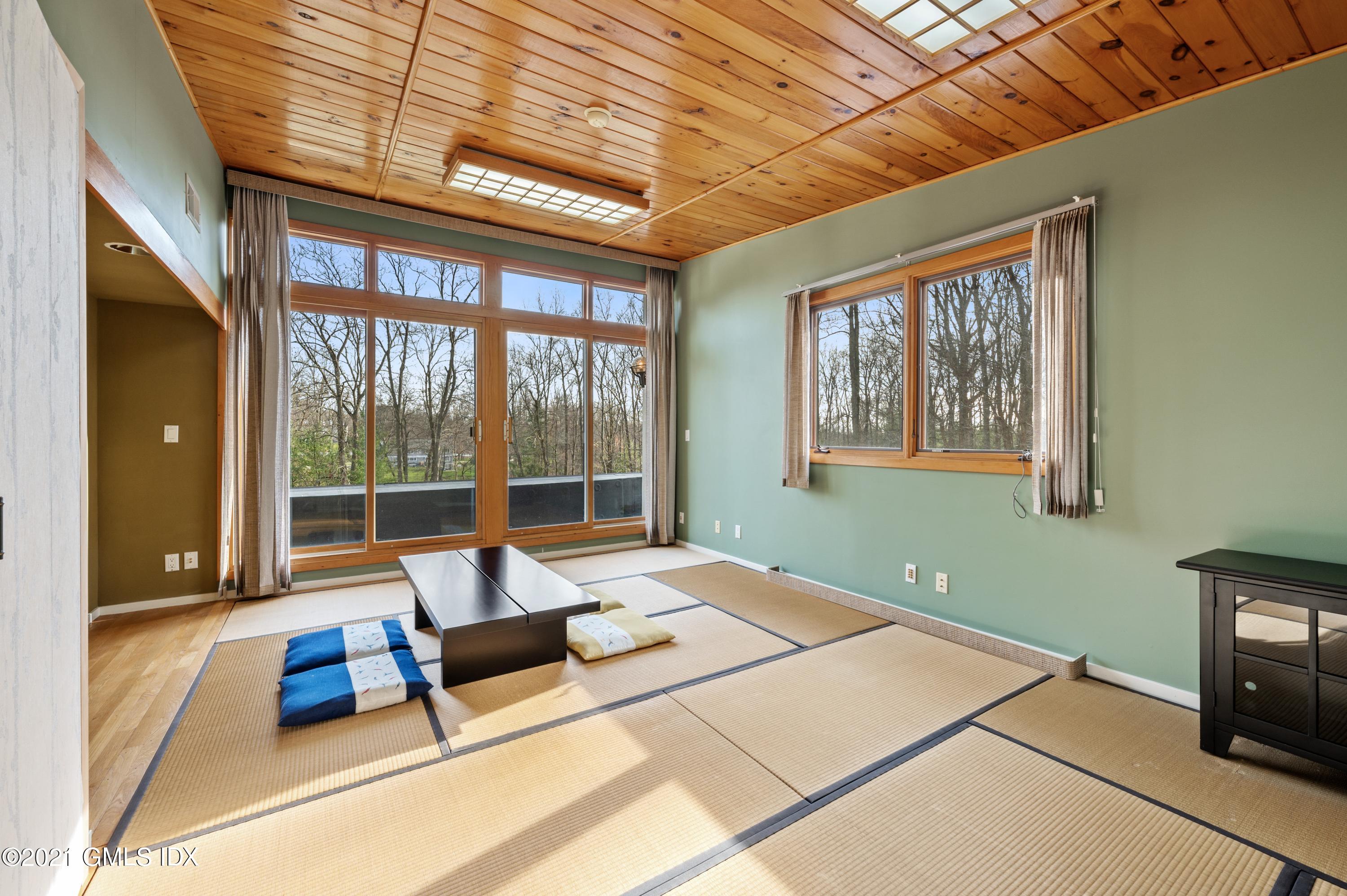 39 Cliffdale Road Greenwich, CT 06831 - Photo 18 of 25 a living room with furniture and floor to ceiling windows