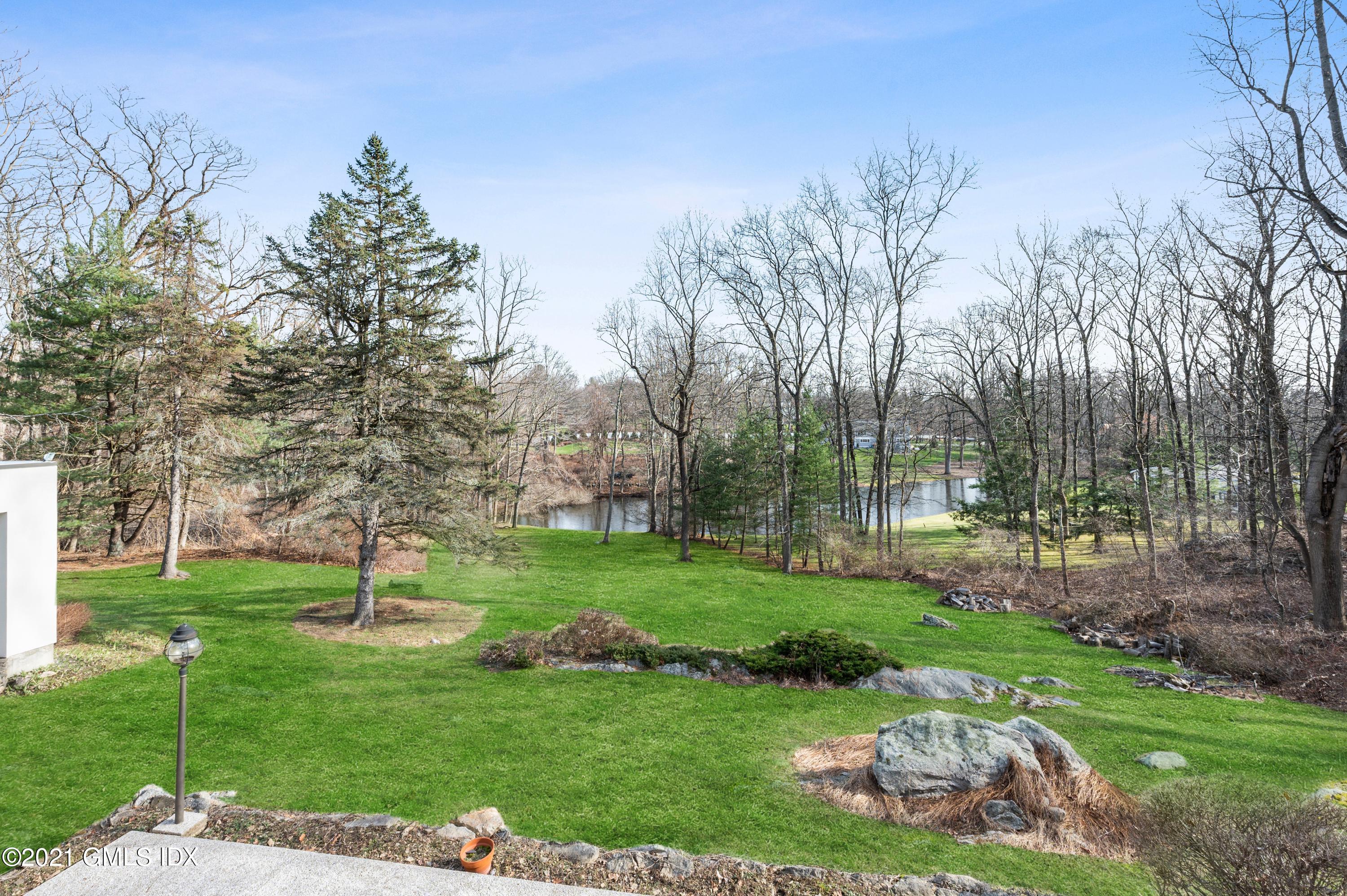 39 Cliffdale Road Greenwich, CT 06831 - Photo 19 of 25 a view of a park with large trees