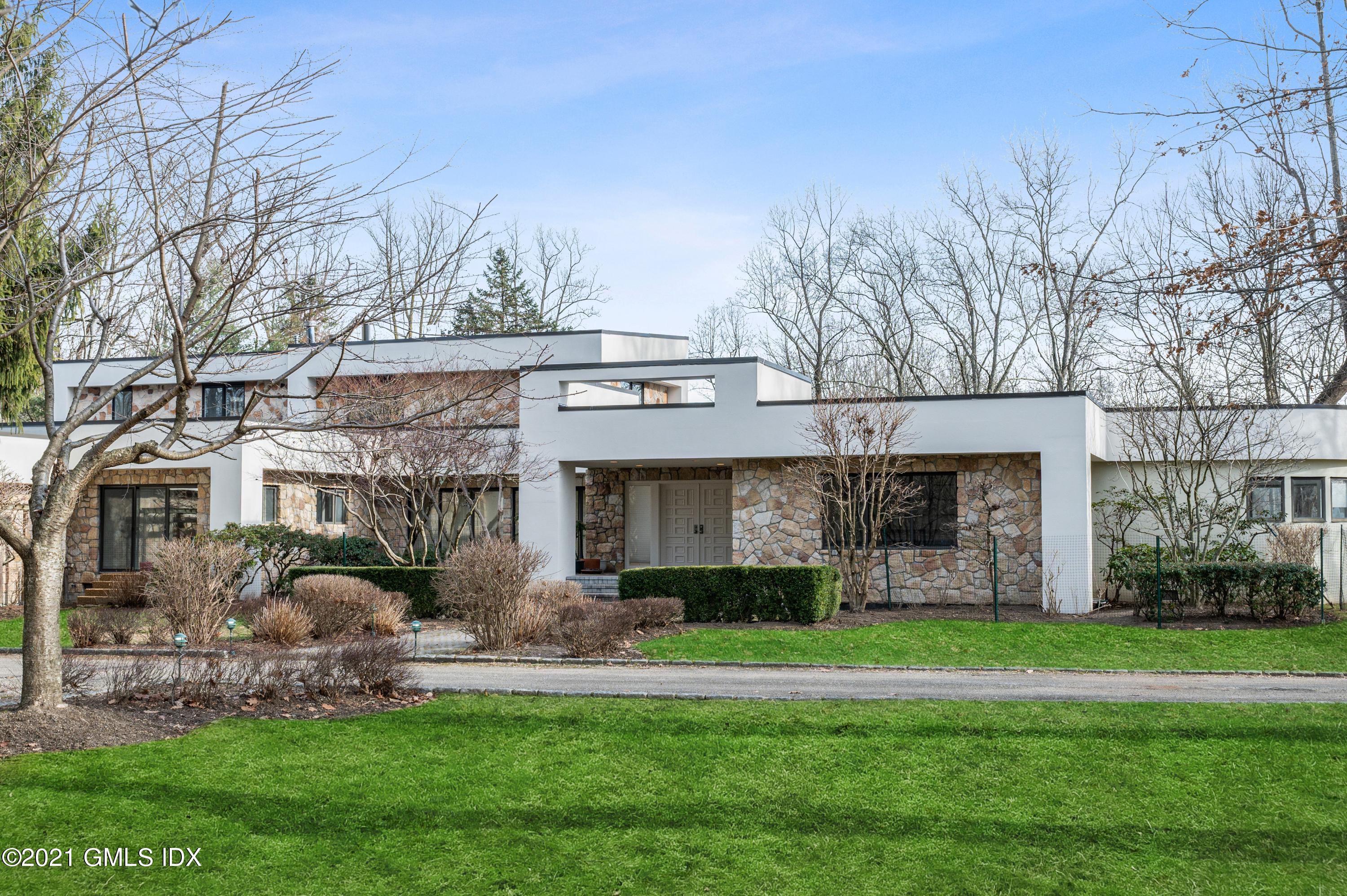 39 Cliffdale Road Greenwich, CT 06831 - Photo 2 of 25 a front view of a house with garden