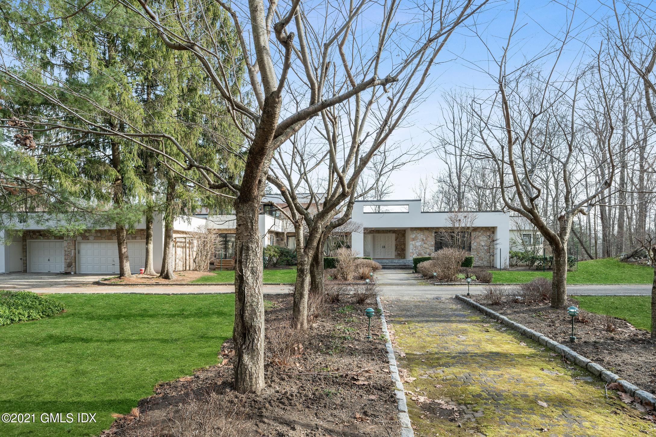 39 Cliffdale Road Greenwich, CT 06831 - Photo 3 of 25 a view of a house with a yard patio and fire pit
