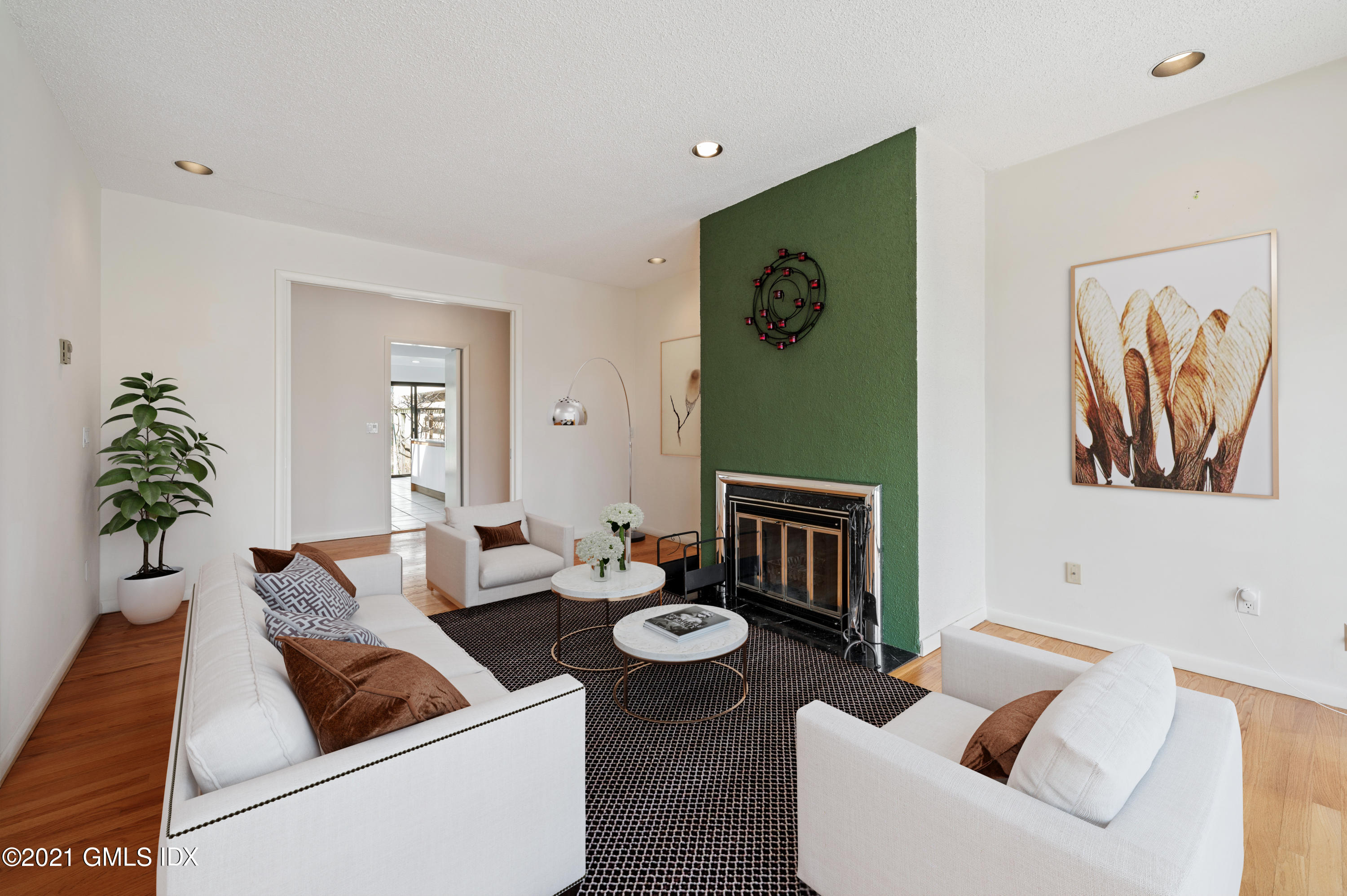 39 Cliffdale Road Greenwich, CT 06831 - Photo 9 of 25 a living room with furniture and a fireplace