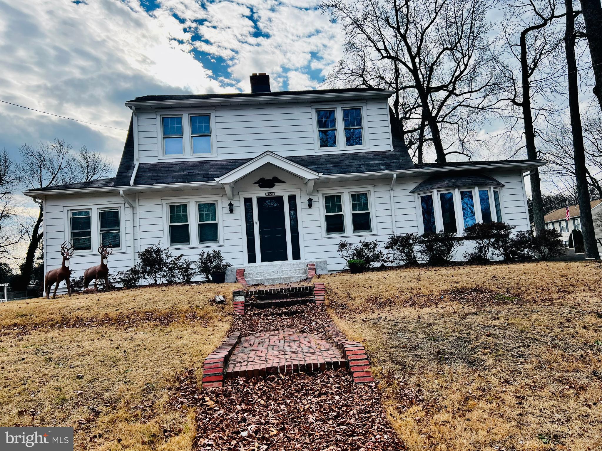 222 Berlin Road North Lindenwold, NJ 08021 - Photo 1 of 7 a front view of a house with a yard outdoor seating and covered with trees