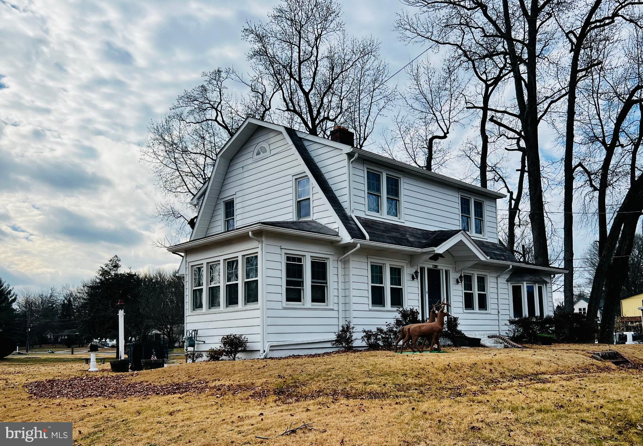 222 Berlin Road North Lindenwold, NJ 08021 - Photo 2 of 7 a front view of a house with a yard covered with snow