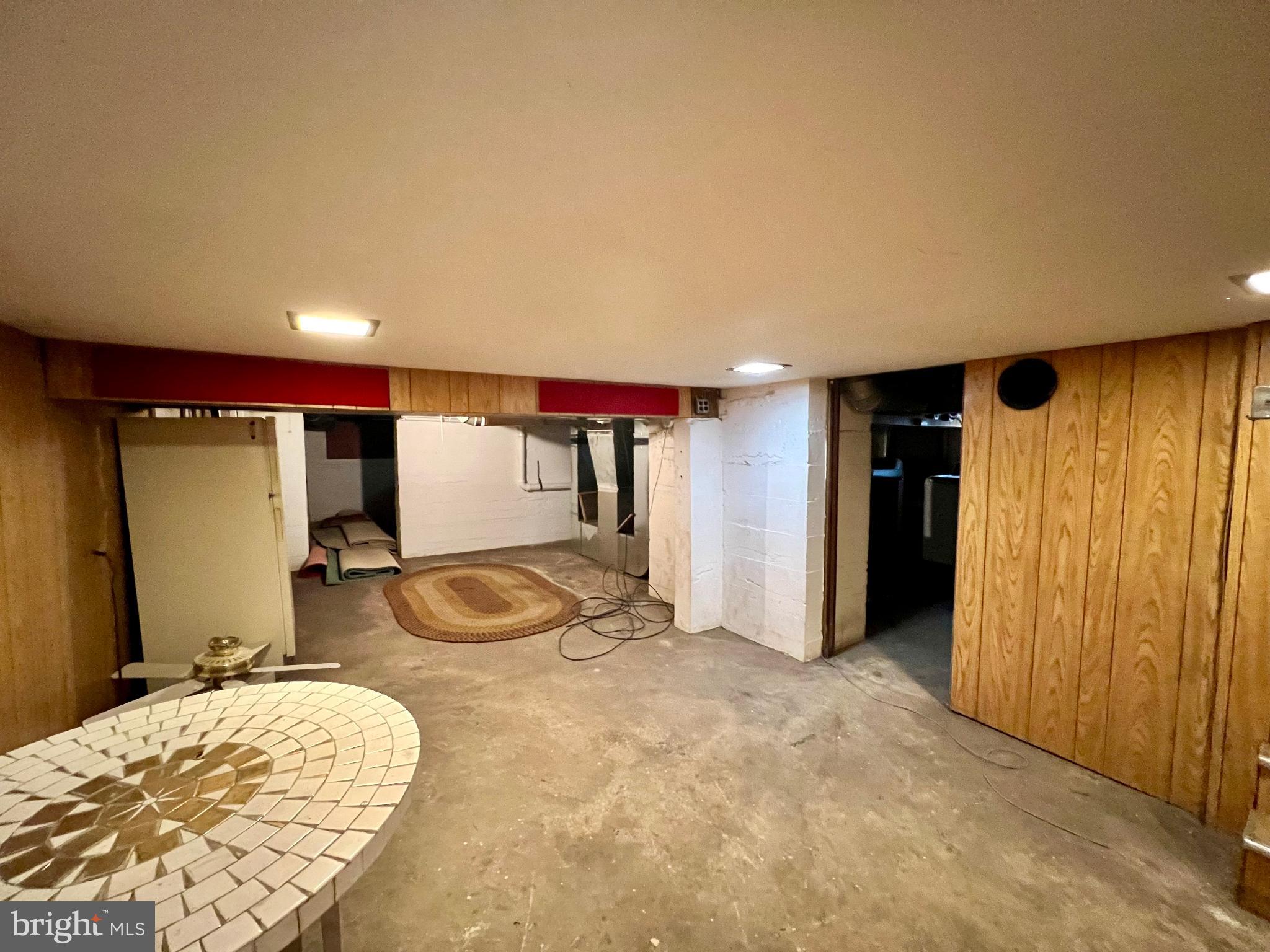 222 Berlin Road North Lindenwold, NJ 08021 - Photo 26 of 26 a room with gym equipment and glass door