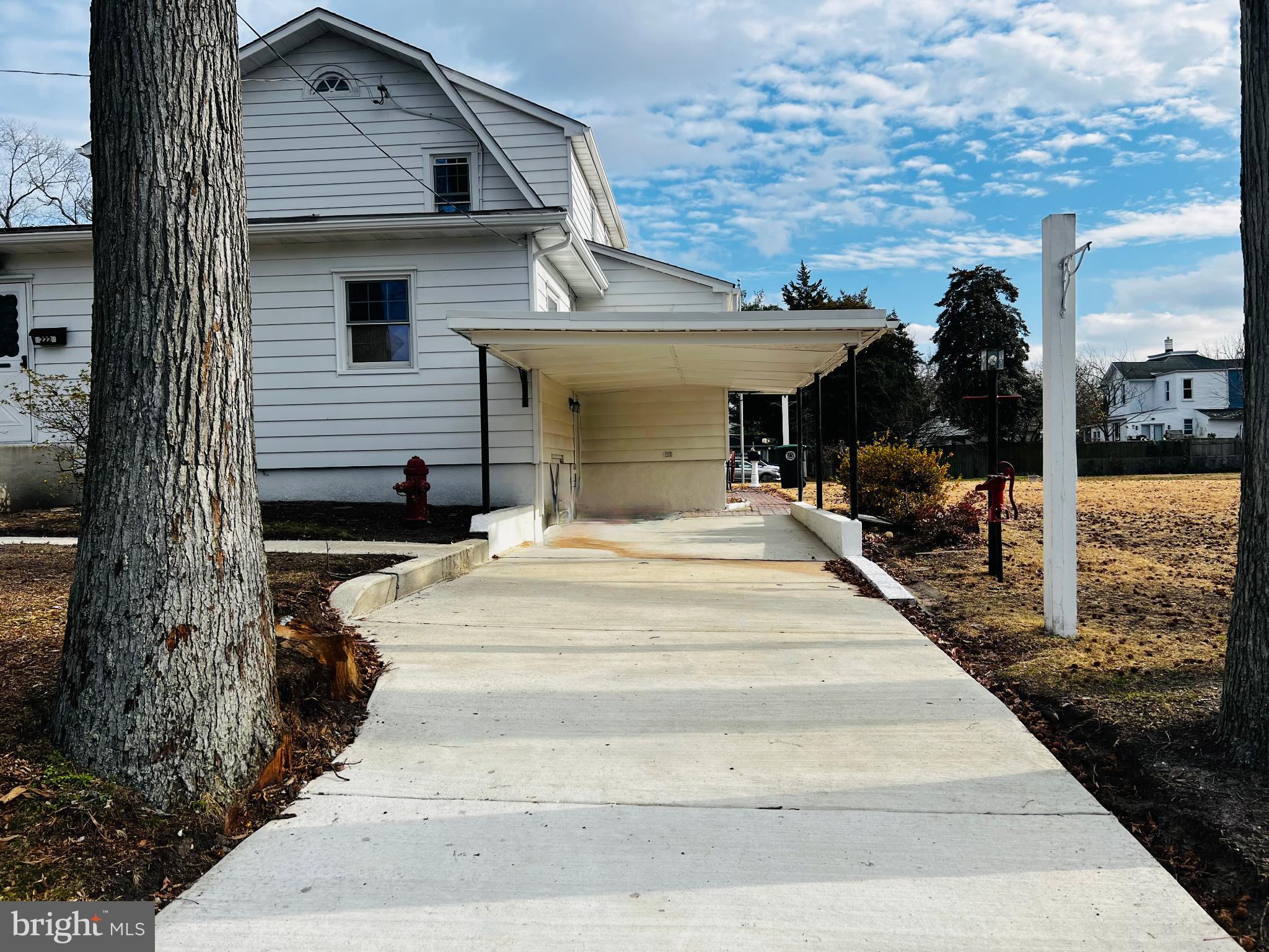 222 Berlin Road North Lindenwold, NJ 08021 - Photo 6 of 7 a front view of a house with a yard