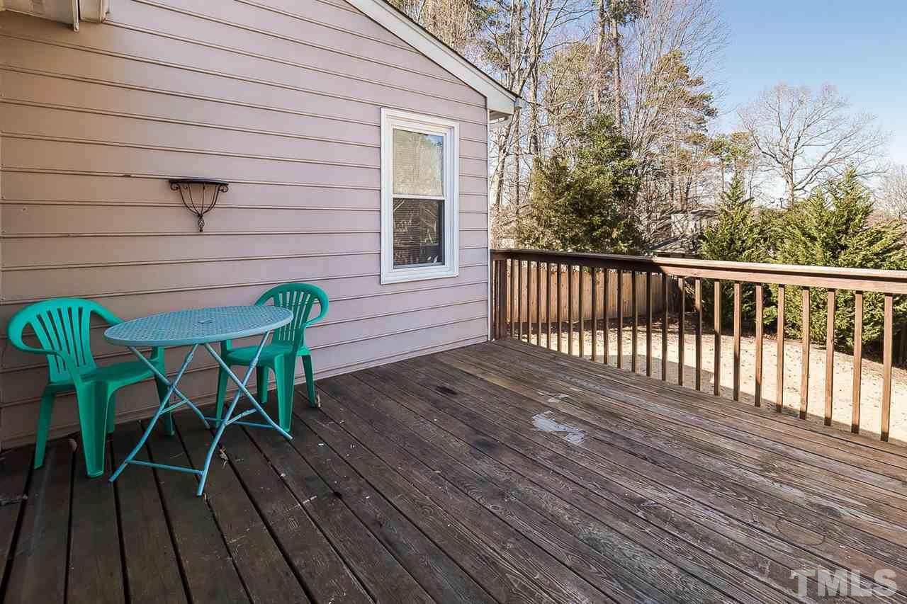 4125 Cobble Court Raleigh, NC 27616 - Photo 12 of 13 a view of a wooden chairs on deck