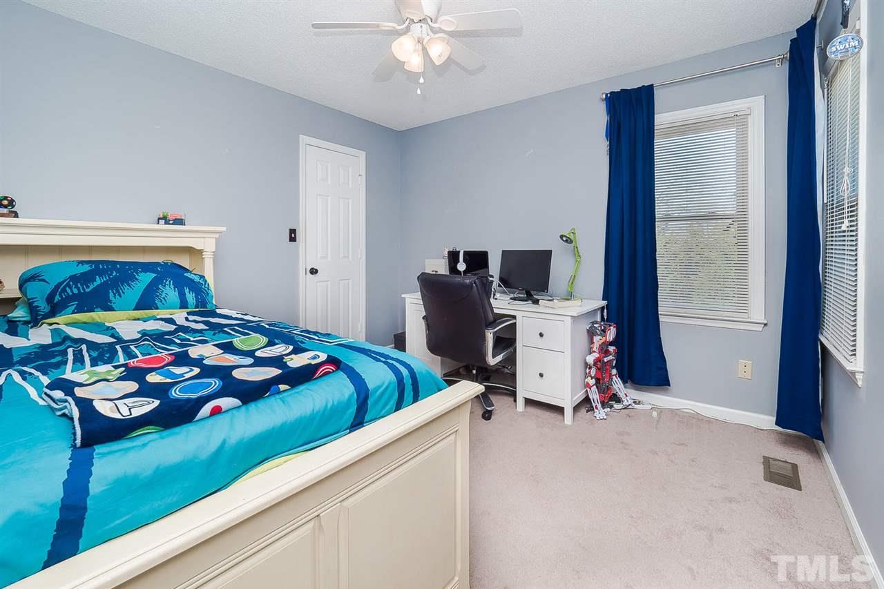 4125 Cobble Court Raleigh, NC 27616 - Photo 10 of 13 a bedroom with bed and a window