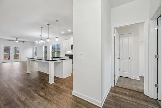 a view of kitchen with table and chairs