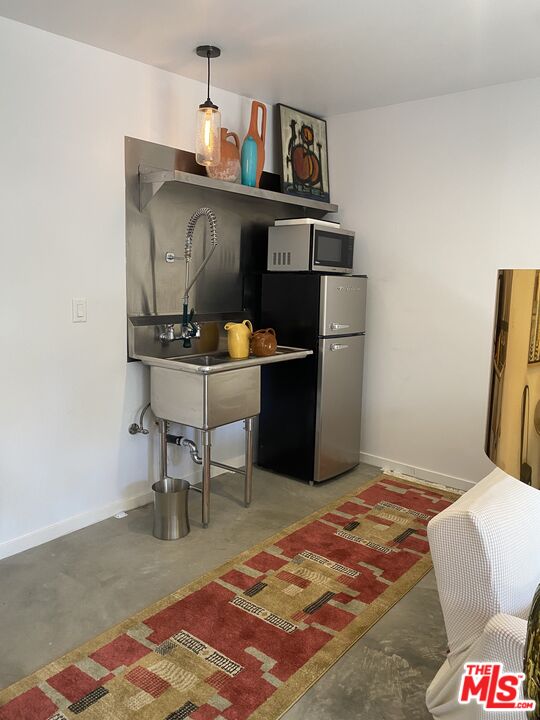 1053 South Alfred Street, Unit A Los Angeles, CA 90035 - Photo 8 of 11 a living room with furniture