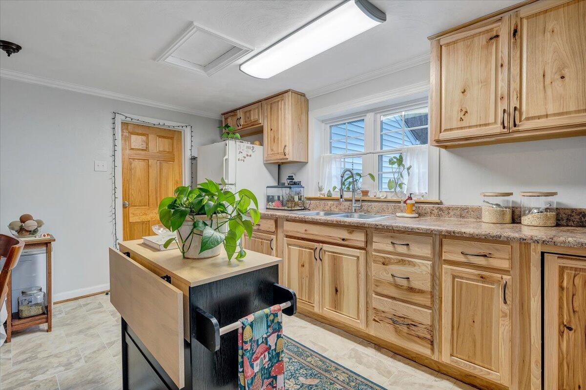 7346 Old Mill Road Roanoke, VA 24018 - Photo 12 of 48 a kitchen with sink cabinets and window