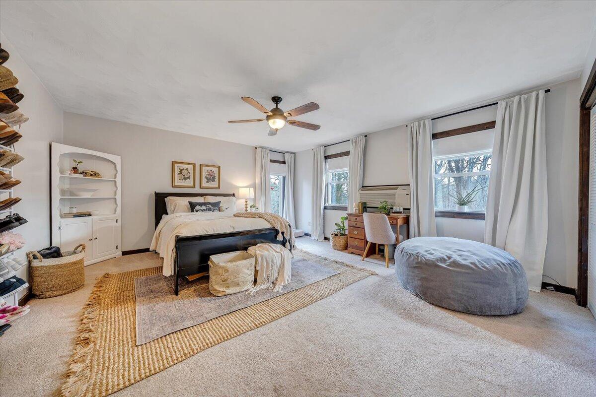 7346 Old Mill Road Roanoke, VA 24018 - Photo 21 of 48 a spacious bedroom with a bed and a chandelier