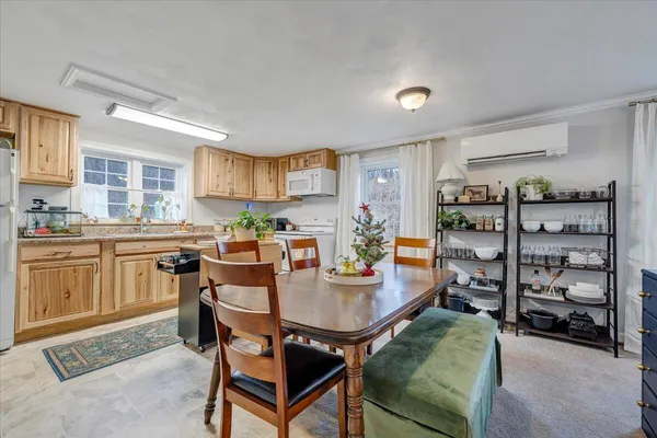 a kitchen with refrigerator and cabinets