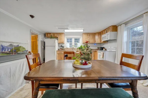 a view of a dining room with furniture and a table