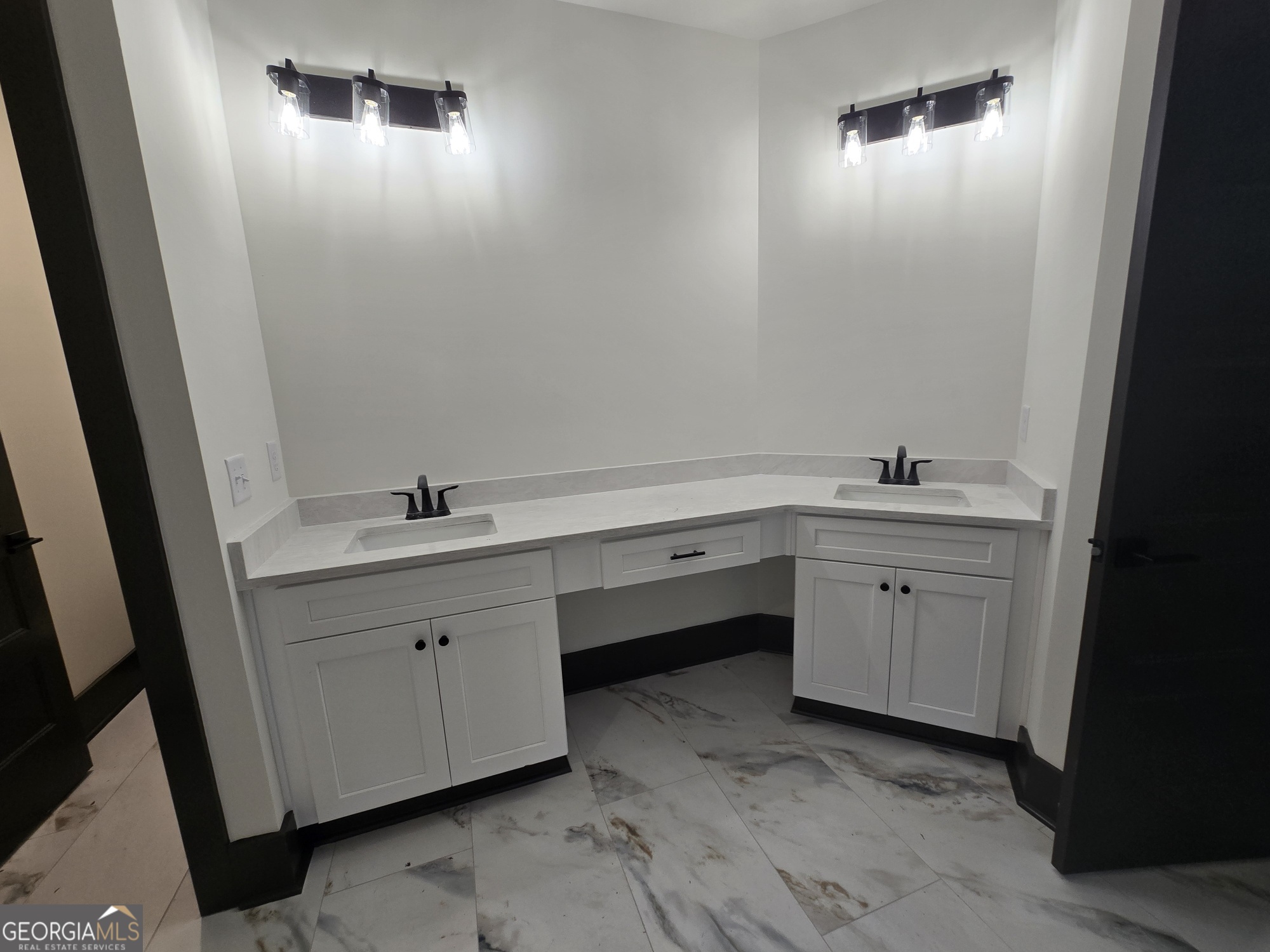 2043 Fischer Road Sharpsburg, GA 30277 - Photo 31 of 51 a bathroom with a sink and a mirror