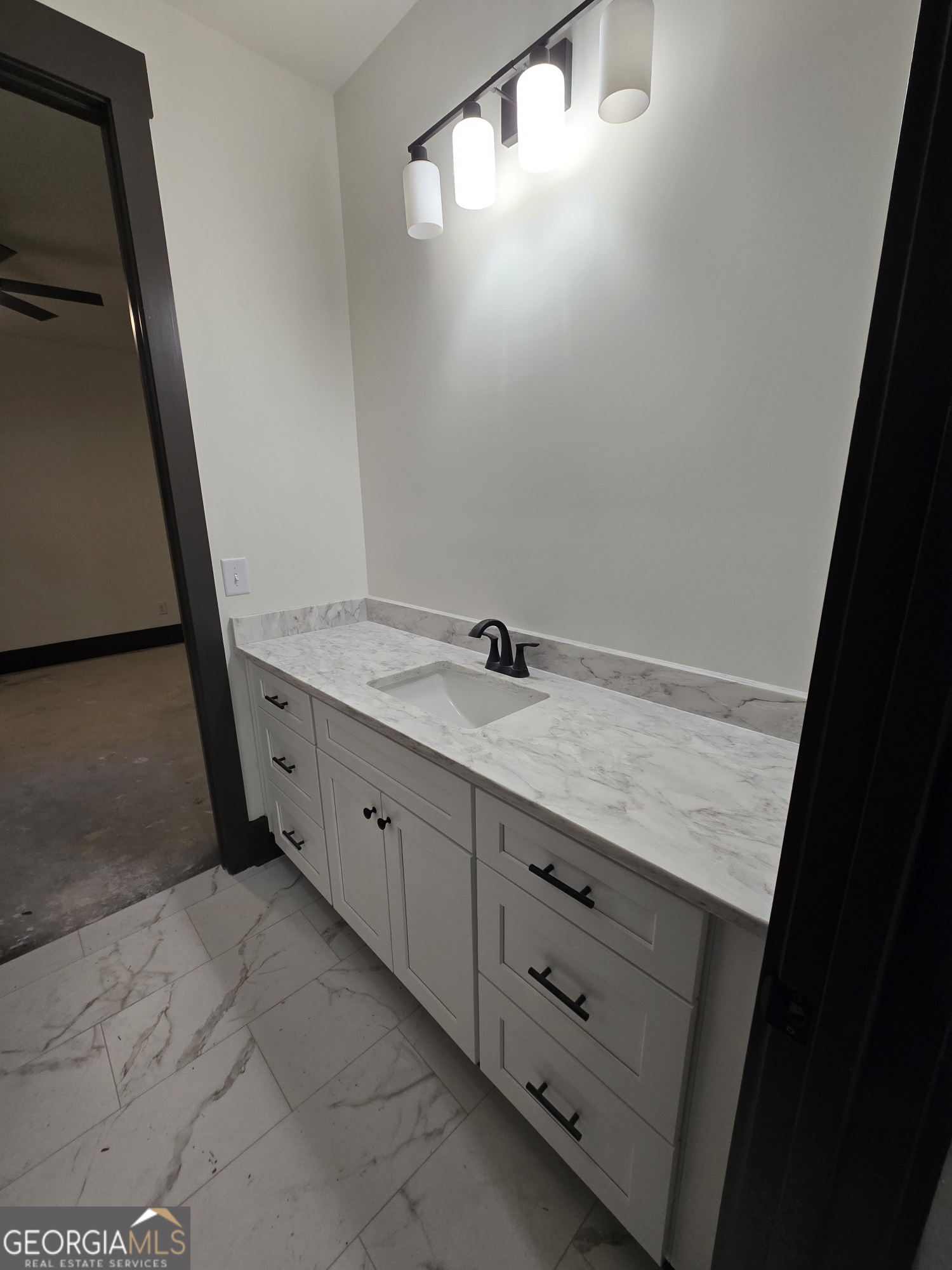 2043 Fischer Road Sharpsburg, GA 30277 - Photo 39 of 51 a bathroom with a double vanity sink and a mirror