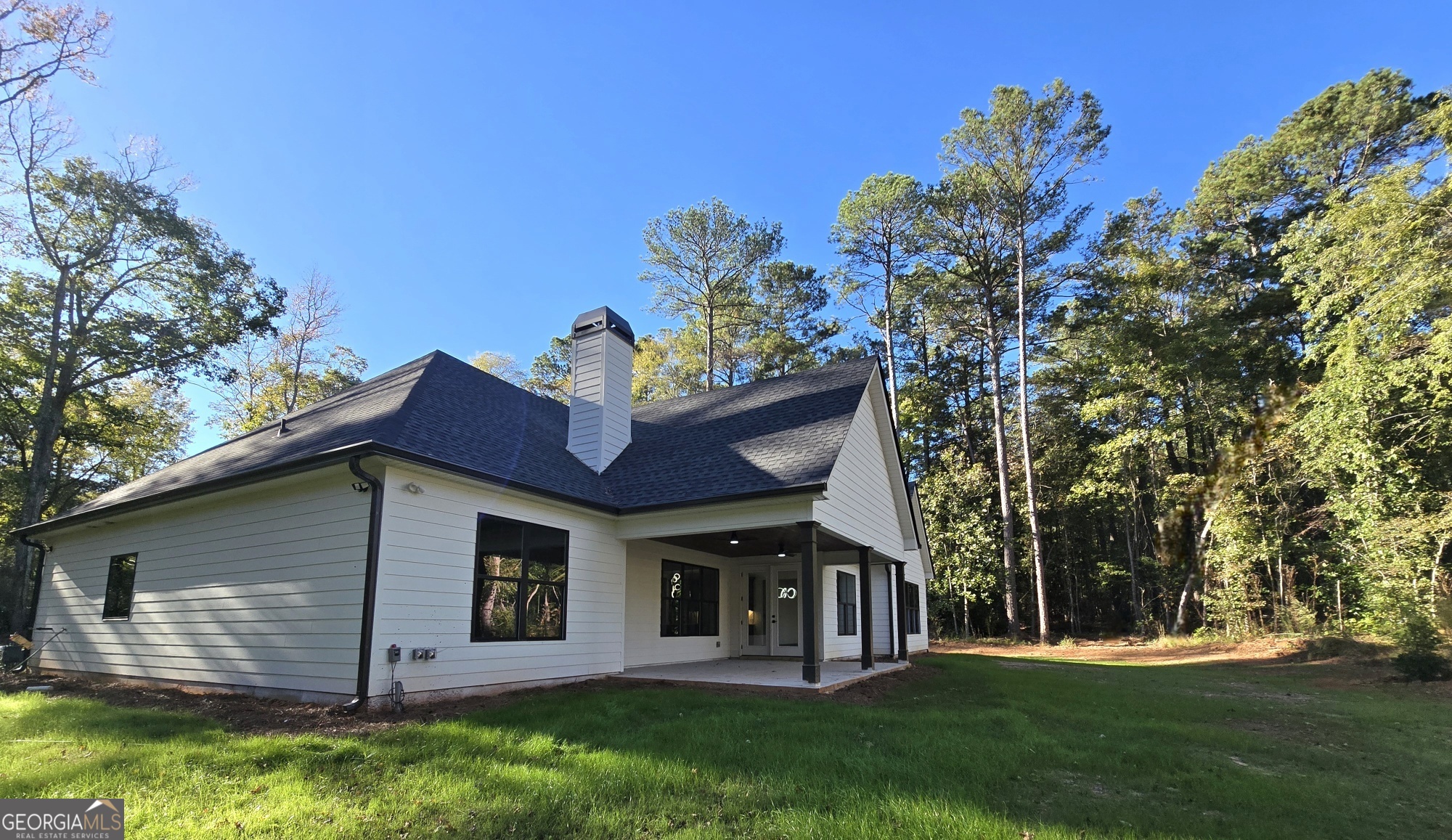 2043 Fischer Road Sharpsburg, GA 30277 - Photo 6 of 51 a front view of a house with a garden
