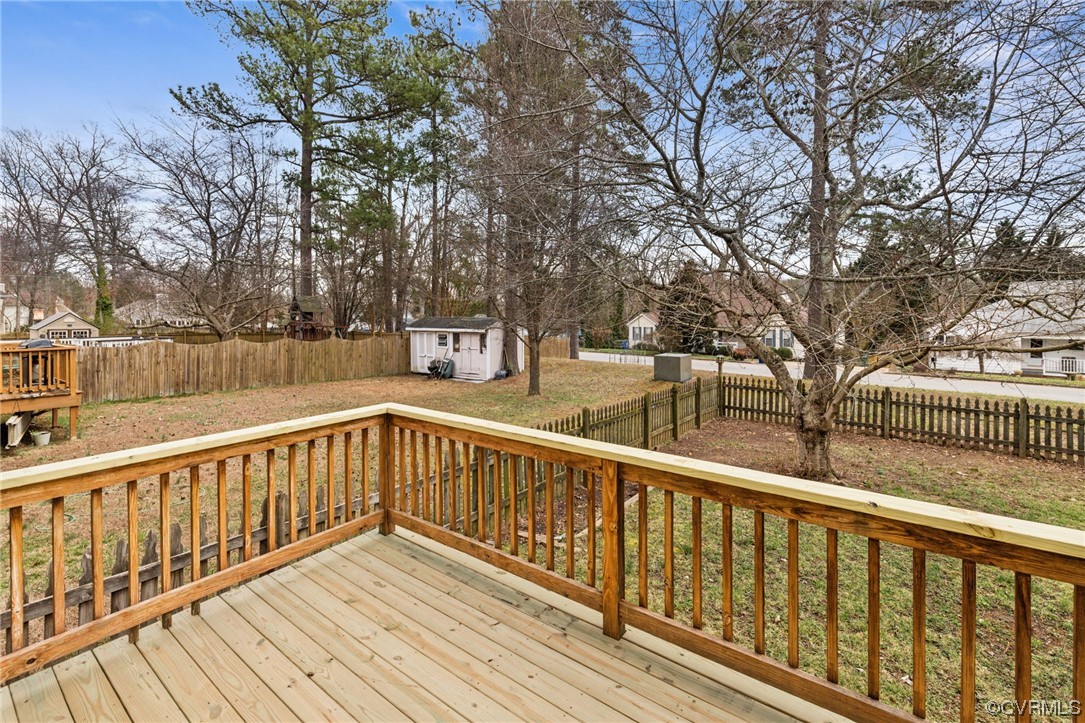 13605 Danwoods Road Midlothian, VA 23113 - Photo 17 of 20 a view of a wooden deck with trees