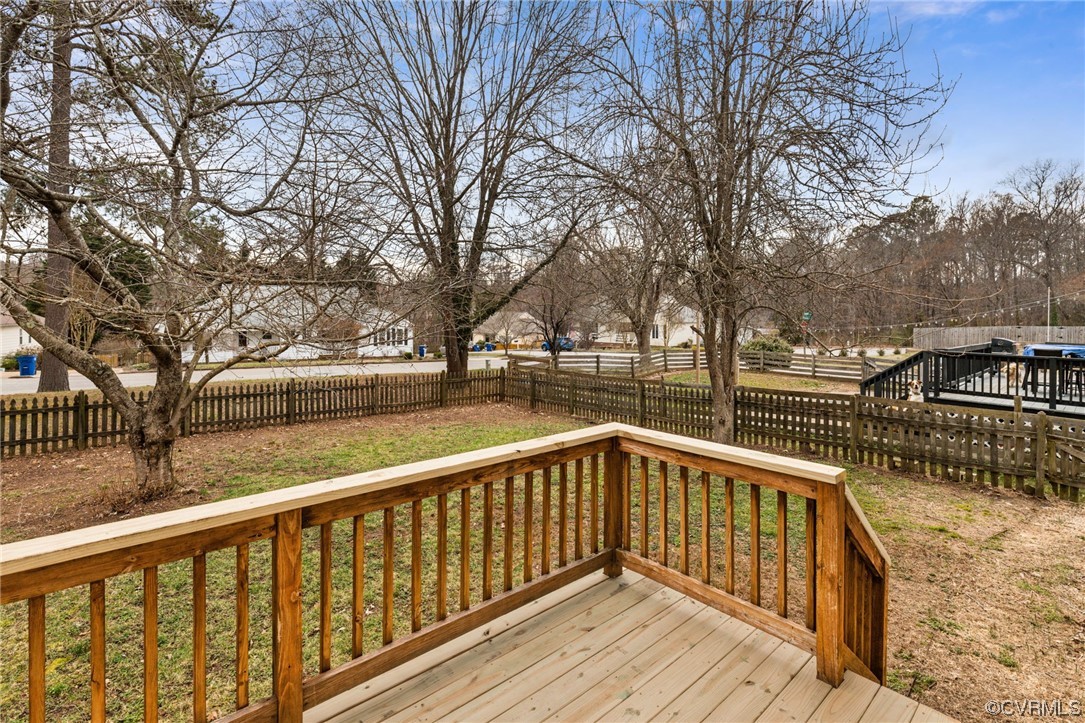 13605 Danwoods Road Midlothian, VA 23113 - Photo 18 of 20 a view of balcony with wooden floor and trees