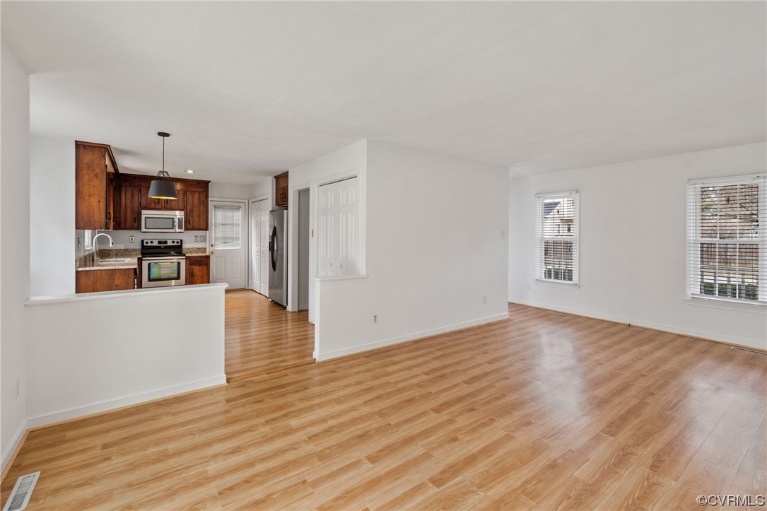 13605 Danwoods Road Midlothian, VA 23113 - Photo 5 of 20 a view of a kitchen with furniture and wooden floor