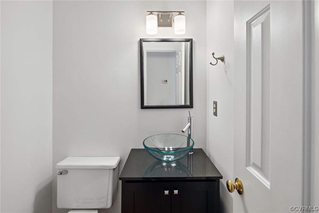 13605 Danwoods Road Midlothian, VA 23113 - Photo 10 of 20 a bathroom with a sink and a mirror