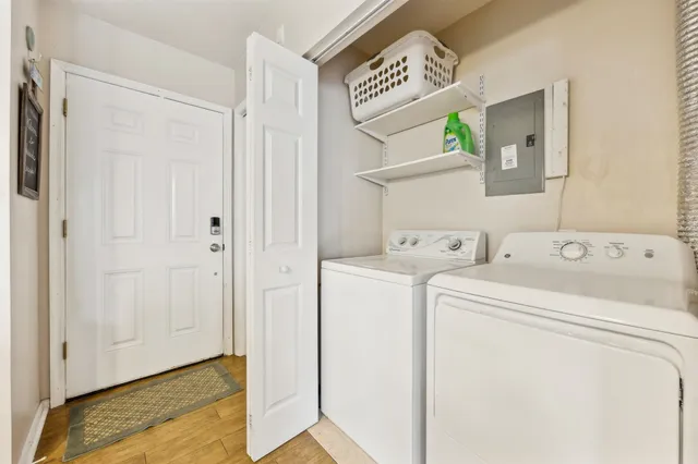 a view of wooden floor and windows in a room