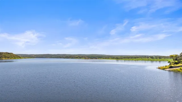 an aerial view of a house with a lake view