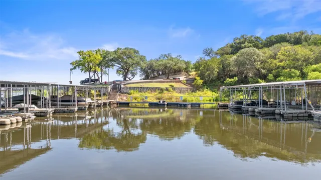 wooden view of a lake with a city