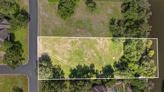 a view of a lake with houses in the background
