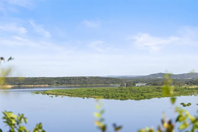 a view of a lake with a building in the background