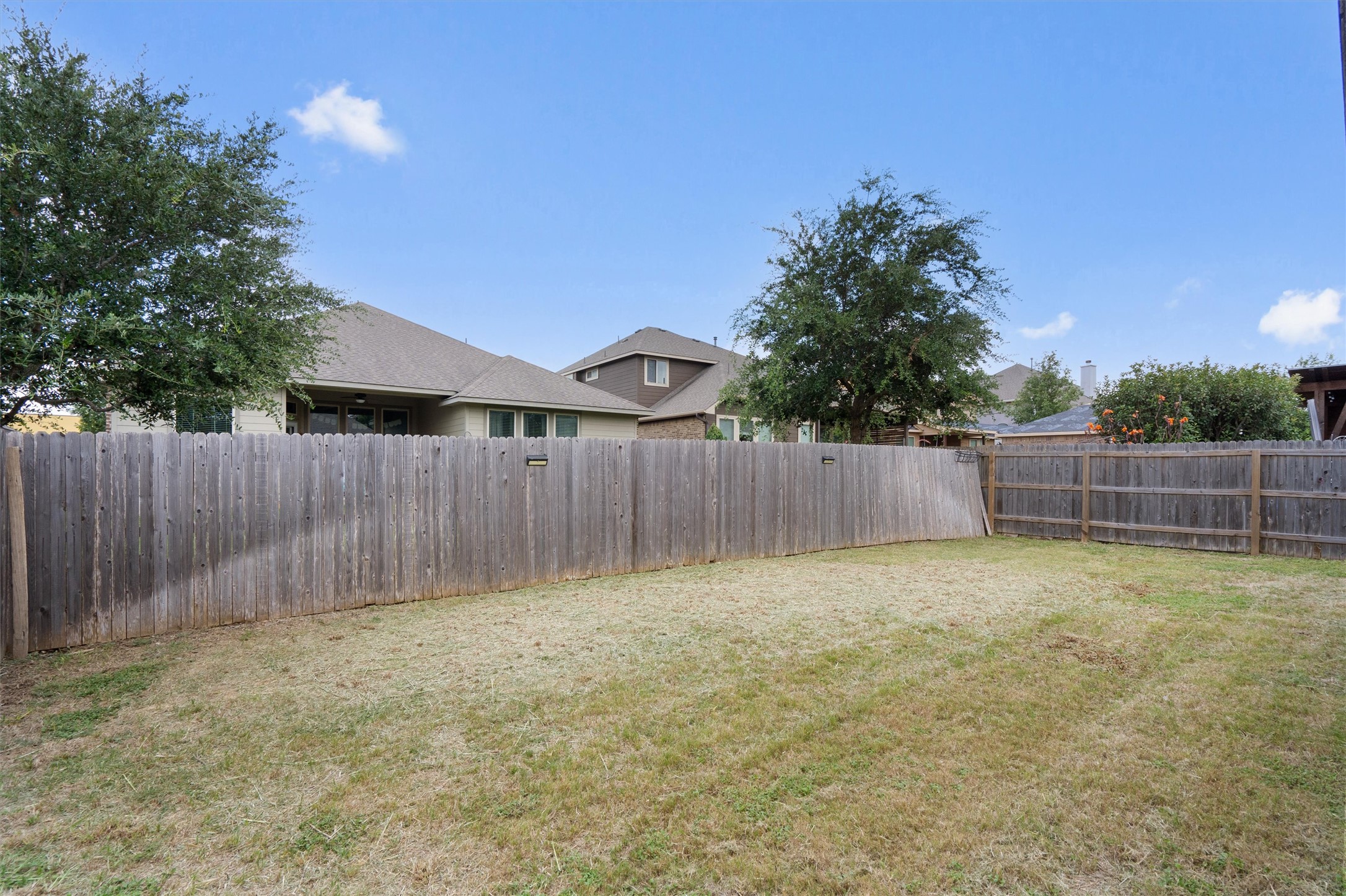 1128 Clearwing Circle Georgetown, TX 78626 - Photo 30 of 38 The backyard - small enough to easily take care of, but large enough for play and backyard fun.