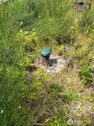 a view of a park with iron fence