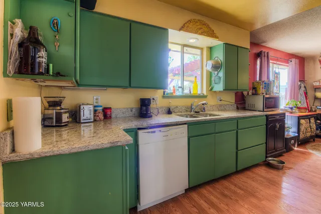 a kitchen with sink and cabinets
