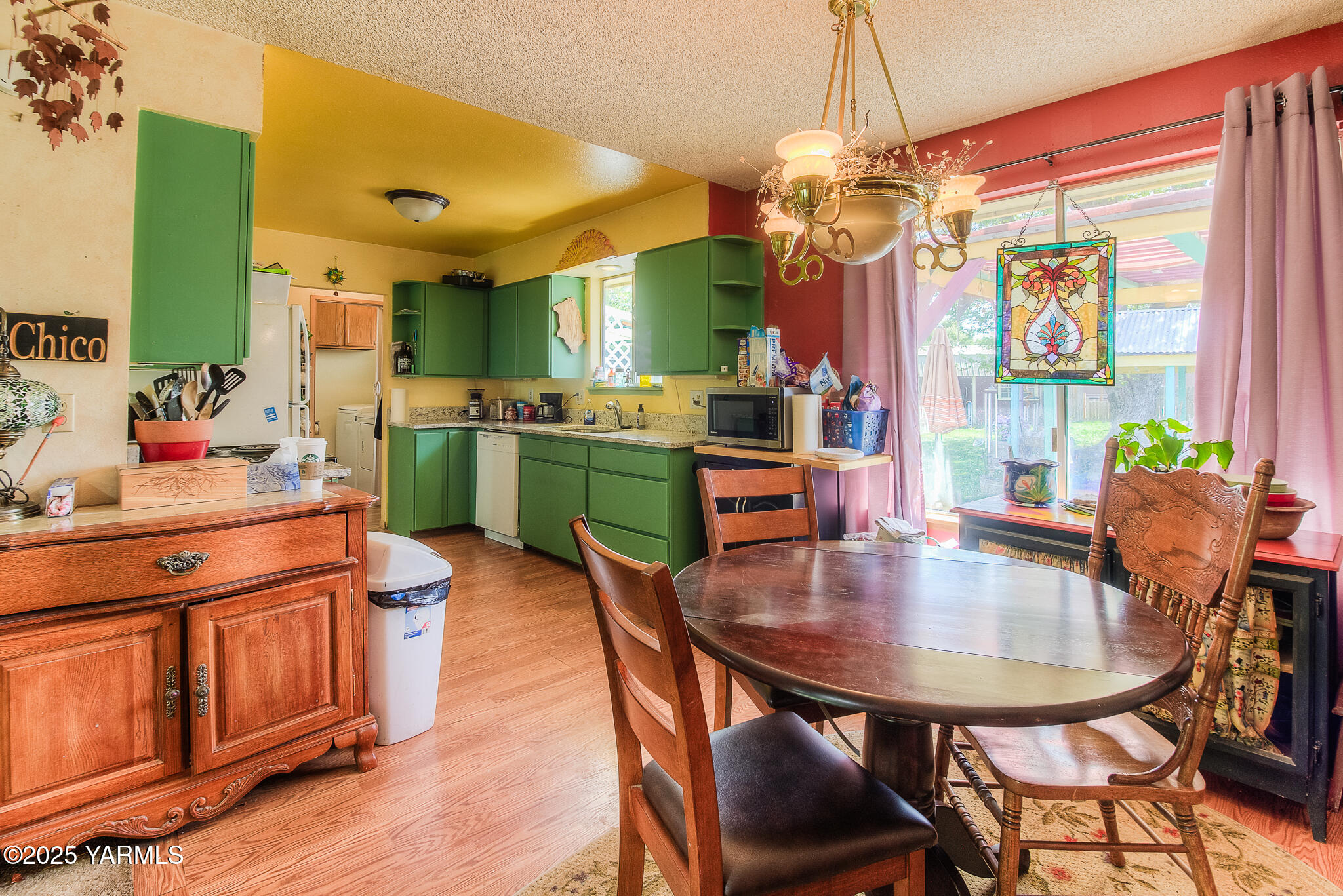 10608 Hackett Road Yakima, WA 98903 - Photo 13 of 40 a dining room dining table chairs and a chandelier