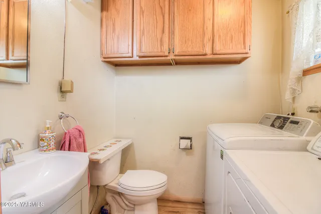 a bathroom with a sink a toilet and a tub