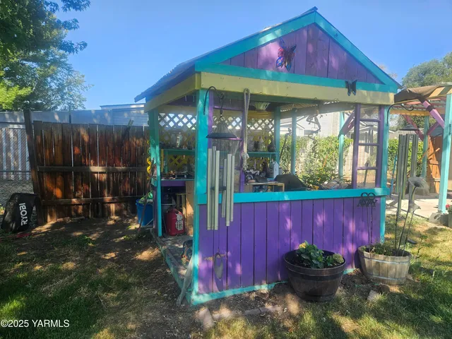 a view of a house with a couches in a patio