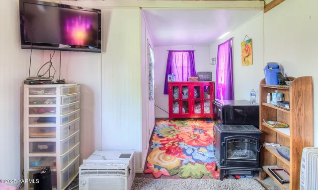 a room with furniture and flat screen tv