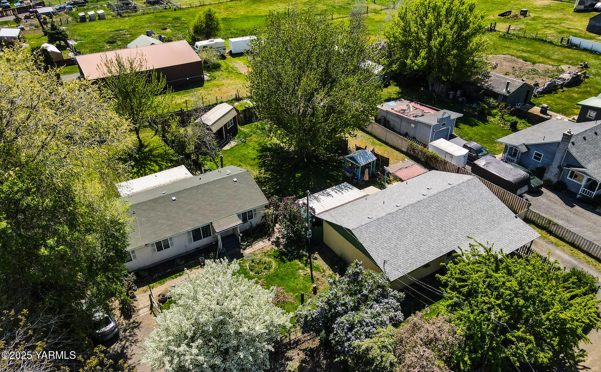10608 Hackett Road Yakima, WA 98903 - Photo 3 of 40 an aerial view of a house with a yard and lake view