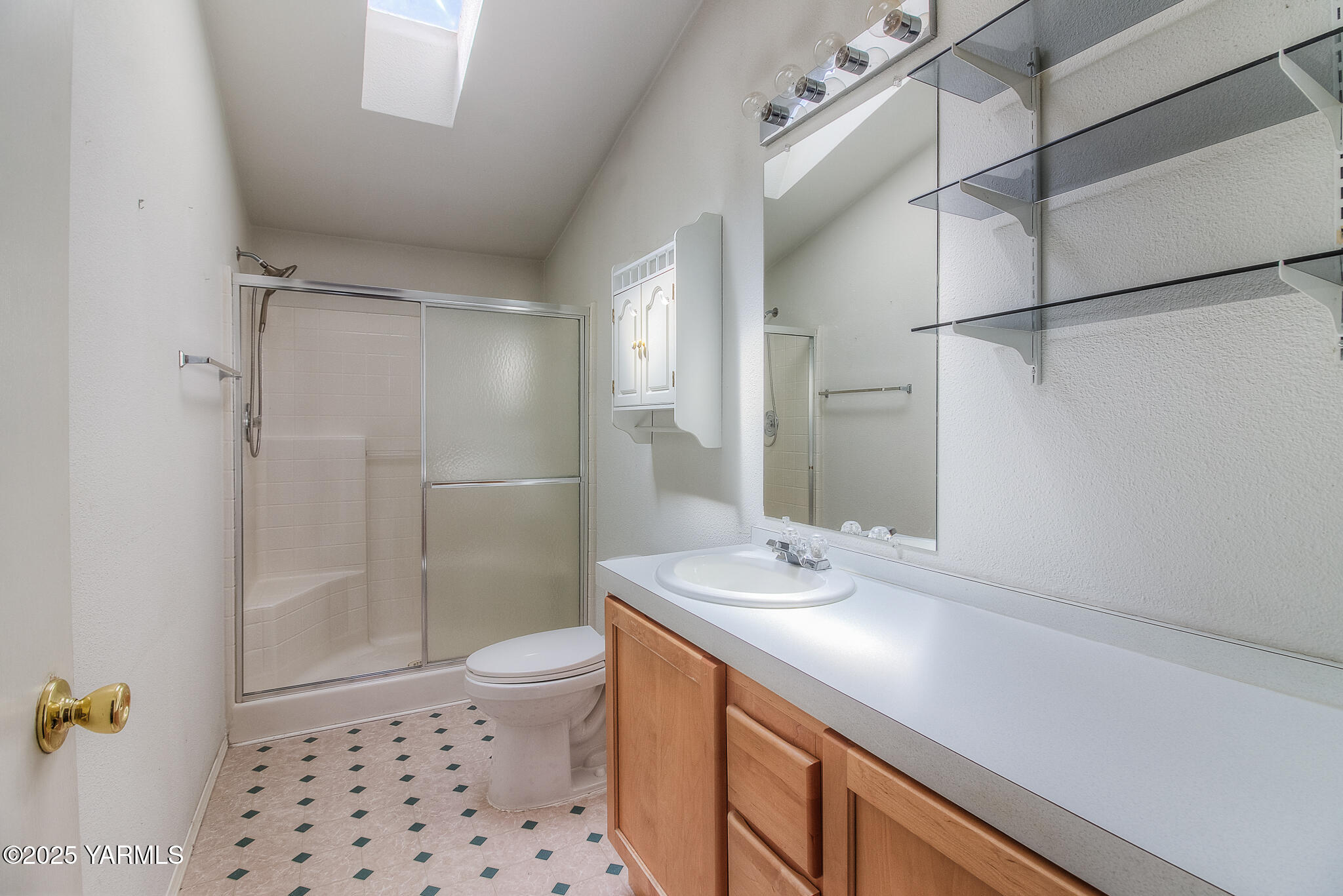 10608 Hackett Road Yakima, WA 98903 - Photo 38 of 40 a bathroom with a sink a toilet and shower